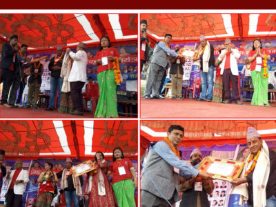 Folk singer Namraj receiving honor from Dhanram KC, former president of National Musicians Association